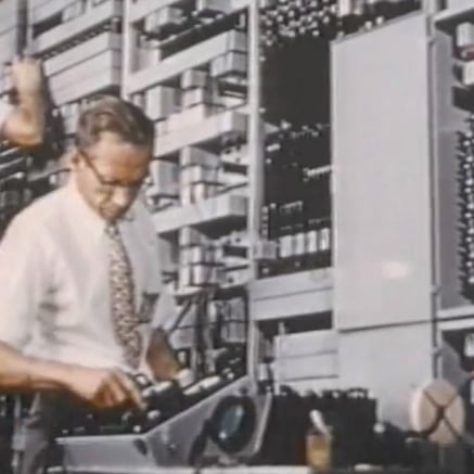 Claud Shannon working on mainframe computer component