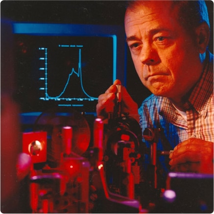 Engineeer in laboratory looking at equipment
