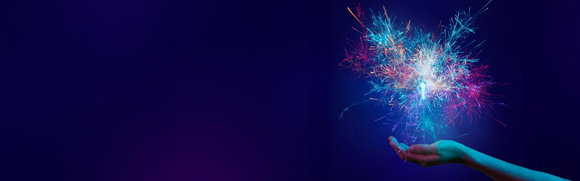 a hand holding a sparkler