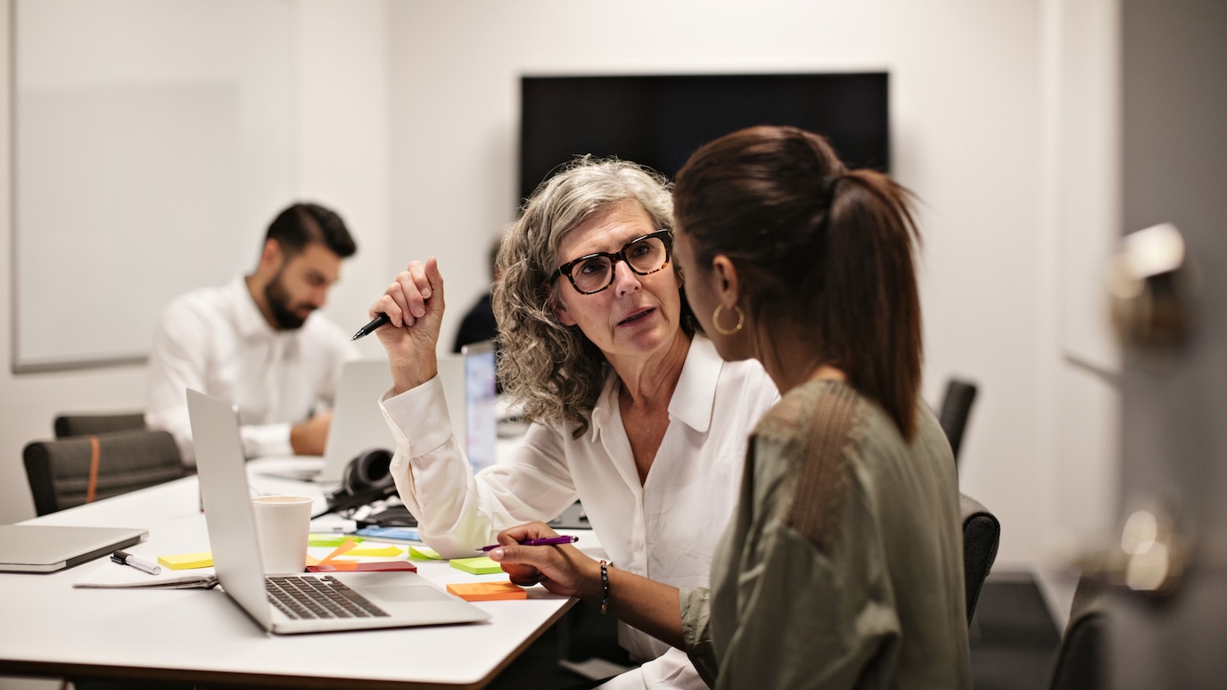 Two women working in front of a laptop